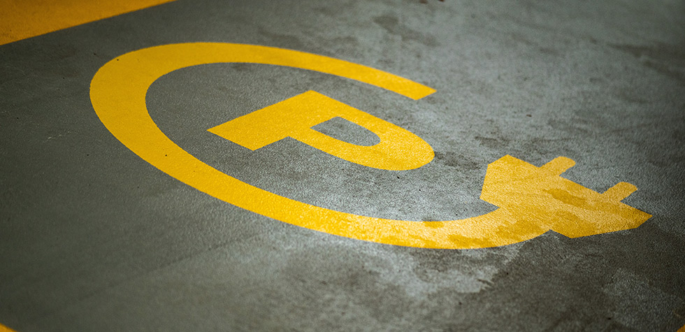 Electric parking point sign painted on floor