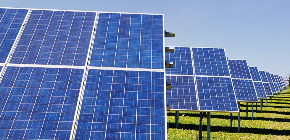 Photo of solar panels on a solar farm