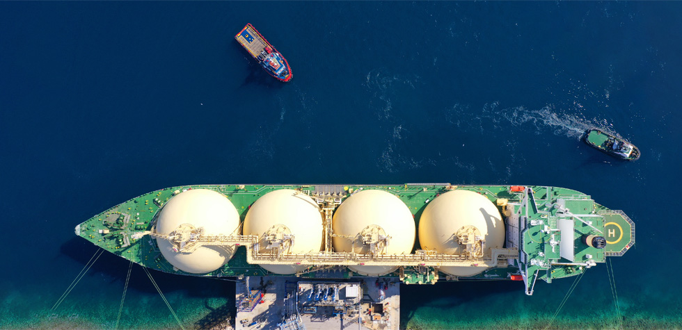 Aerial photo of an LNG shipping tanker in dock