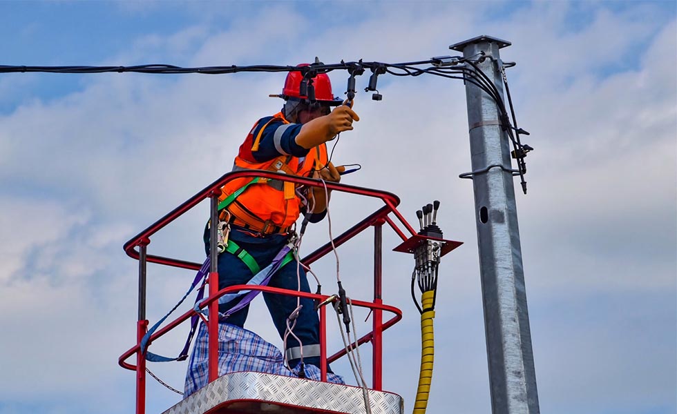 Photo of Engineer working one elcetrcial cables