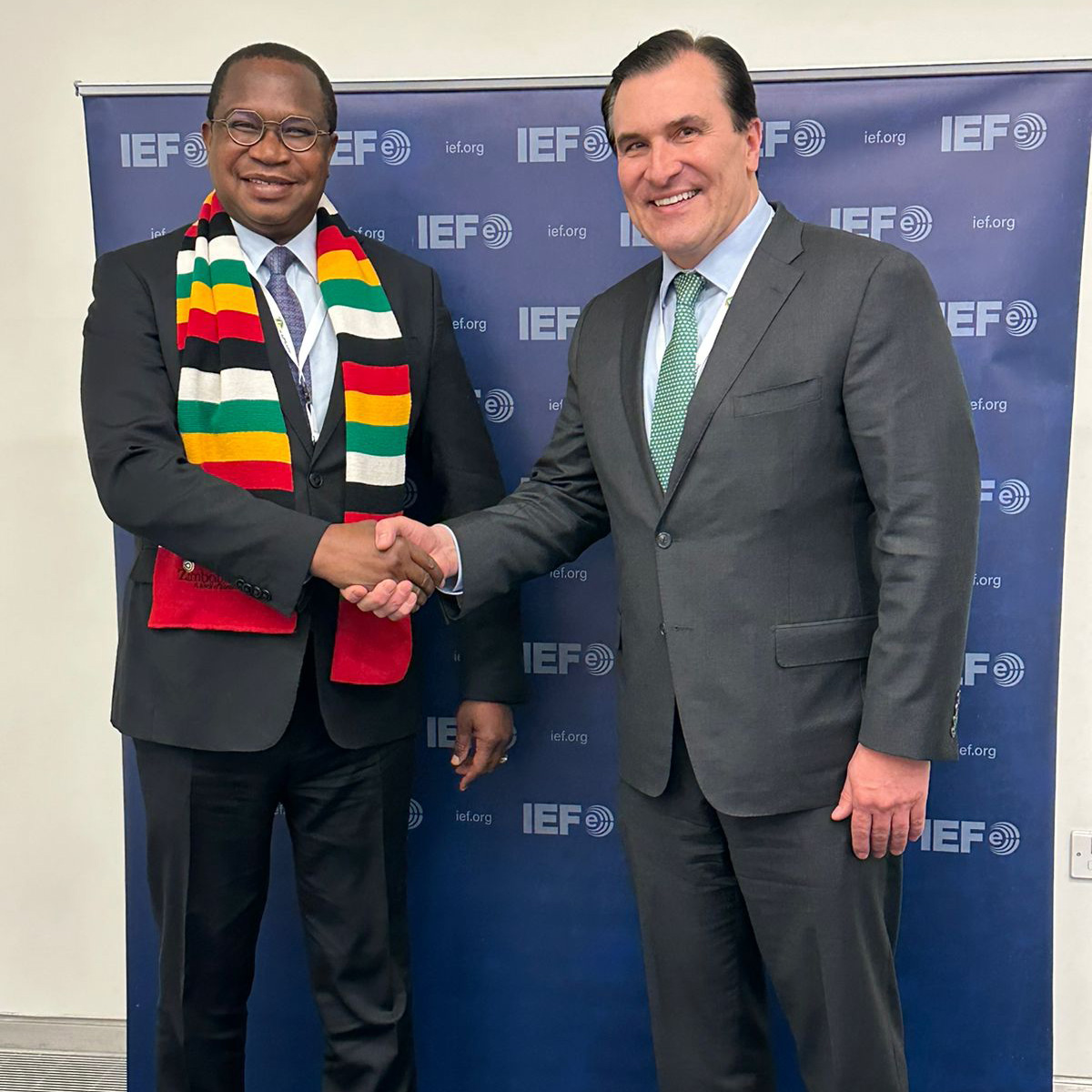 Joseph McMonigle shaking hands with Mthuli Ncube